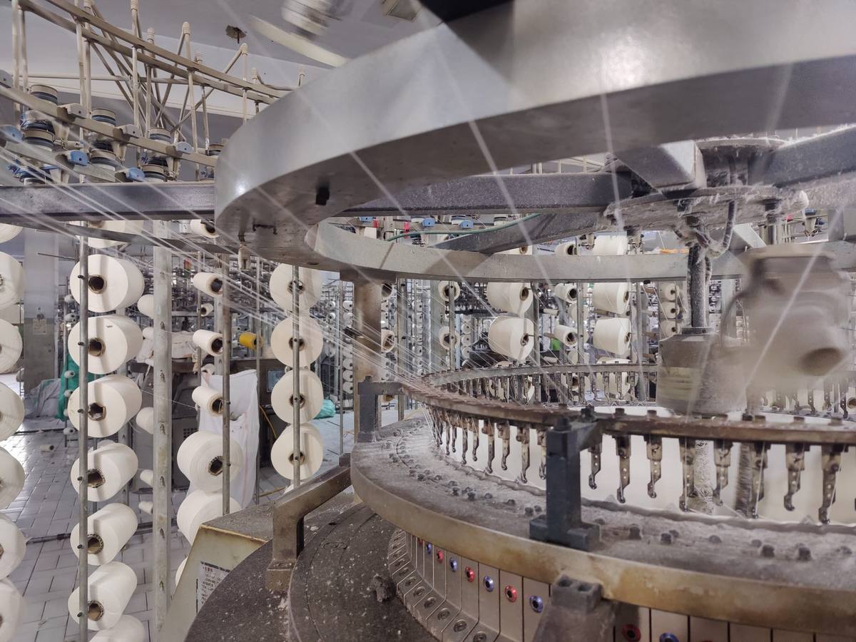 TTI Knitwear knitting floor with yarn cones